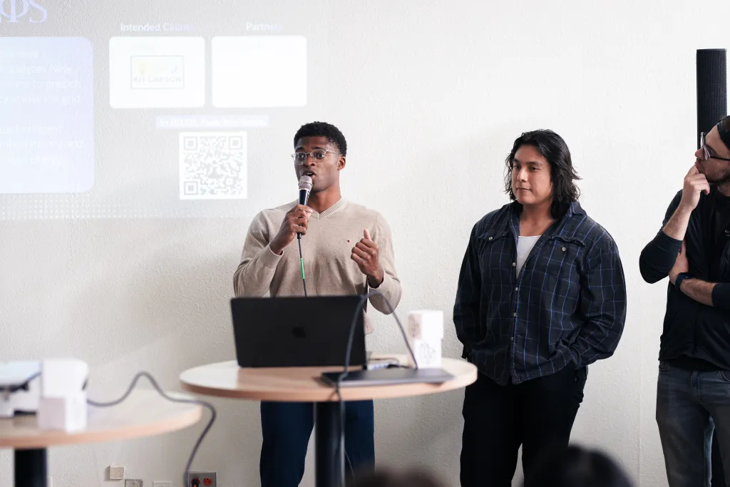 Team presenting energy grid project at Desert Dev Lab 2025