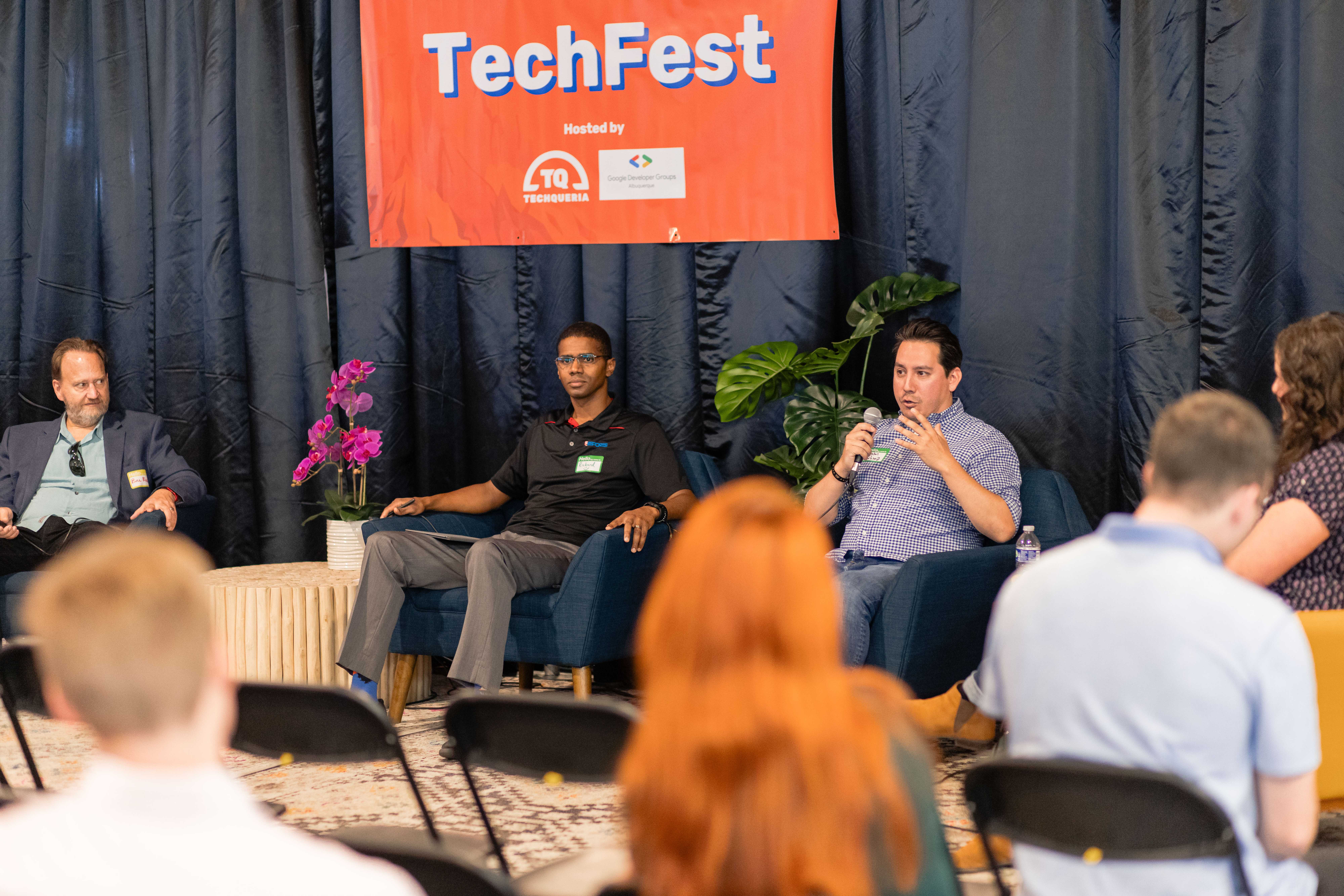 Panel discussion at TechFest 2024 with speakers on stage